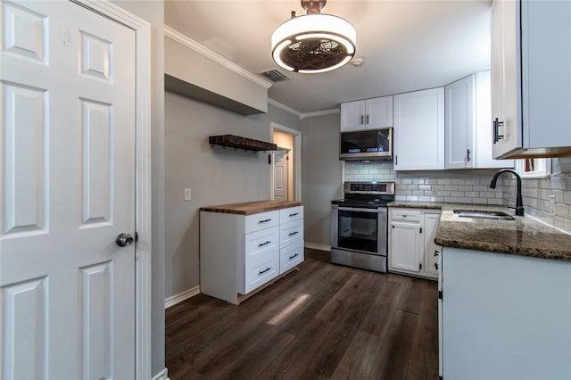 4001 Cott St, Corpus Christi, TX 78411 - kitchen featuring appliances with stainless steel finishes, a sink, open shelves, crown molding, and decorative backsplash