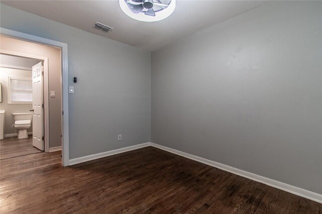 4001 Cott St, Corpus Christi, TX 78411 - spare room featuring baseboards and dark wood-style floors