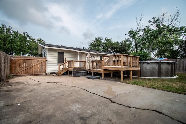 4001 Cott St, Corpus Christi, TX 78411 - rear view of property featuring a deck and a gate