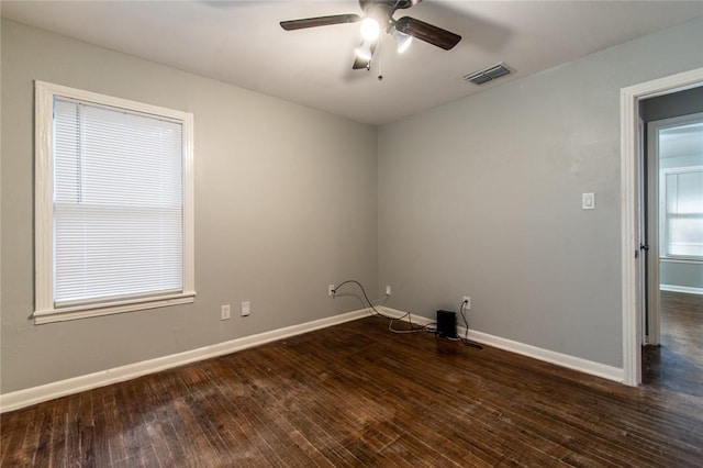 4001 Cott St, Corpus Christi, TX 78411 - spare room featuring a ceiling fan, dark wood-style floors, and baseboards