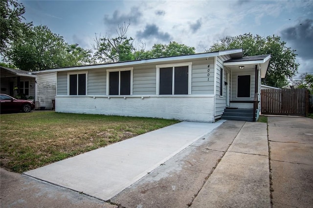 4001 Cott St, Corpus Christi, TX 78411 - view of front of house featuring brick siding and a front yard