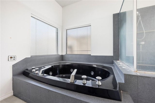 bathroom featuring a jetted tub