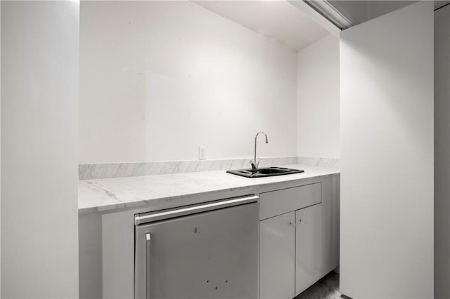 kitchen with stainless steel refrigerator and a sink