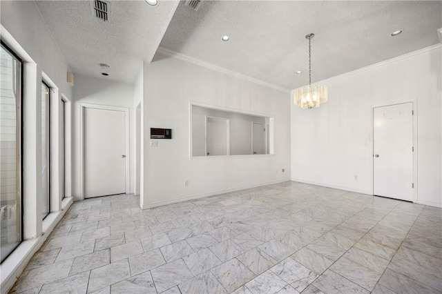 empty room with crown molding, visible vents, an inviting chandelier, a textured ceiling, and baseboards