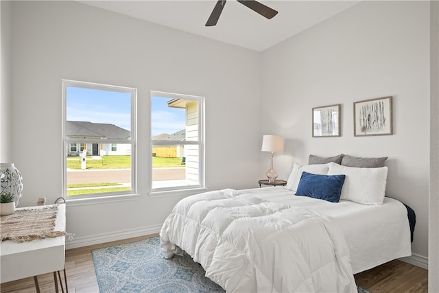 bedroom with hardwood / wood-style floors and ceiling fan