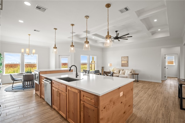 kitchen featuring light hardwood / wood-style flooring, sink, an island with sink, and coffered ceiling