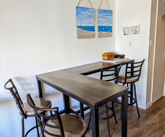 3938 Surfside Blvd Unit 3129, Corpus Christi, TX 78402 - dining space featuring wood finished floors and baseboards