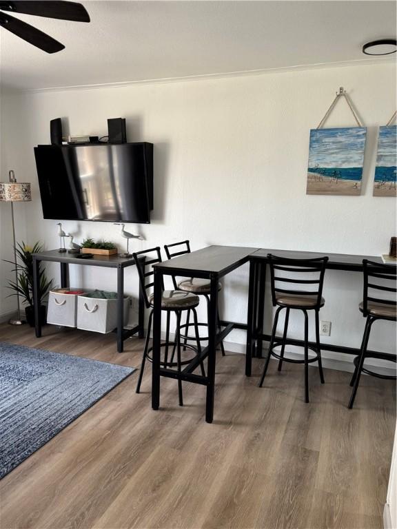 3938 Surfside Blvd Unit 3129, Corpus Christi, TX 78402 - dining space featuring wood finished floors, ceiling fan, and baseboards