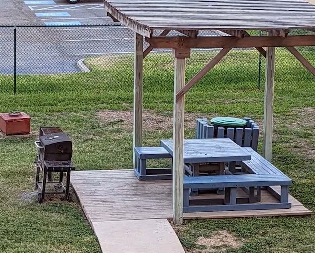 3938 Surfside Blvd Unit 3129, Corpus Christi, TX 78402 - wooden terrace with outdoor dining area and grilling area