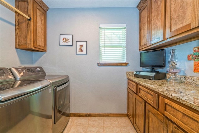 washroom with cabinets and separate washer and dryer