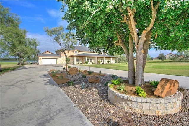 single story home with a garage and a front yard