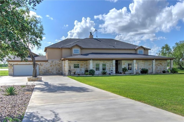 view of front facade featuring a garage and a front yard