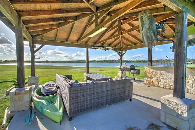 view of patio / terrace with a gazebo, a water view, outdoor lounge area, and area for grilling