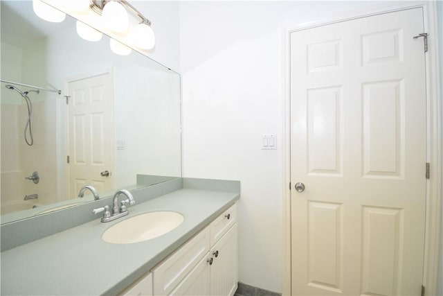 bathroom with vanity and  shower combination