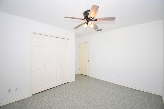 unfurnished bedroom featuring a closet and ceiling fan