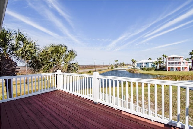 wooden deck featuring a water view