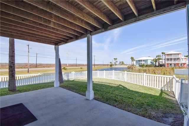 view of patio with a water view