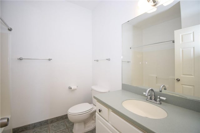 bathroom featuring tile patterned floors, vanity, toilet, and walk in shower