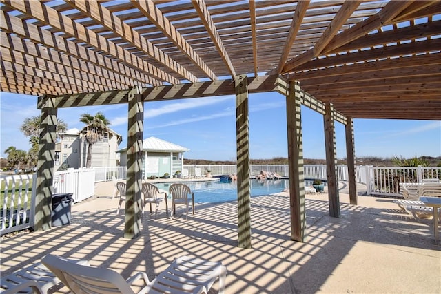 view of patio / terrace featuring a water view and a pergola