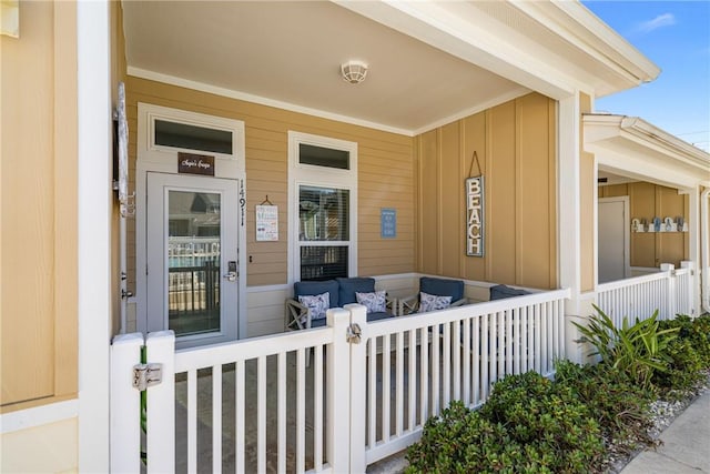 view of exterior entry featuring a porch