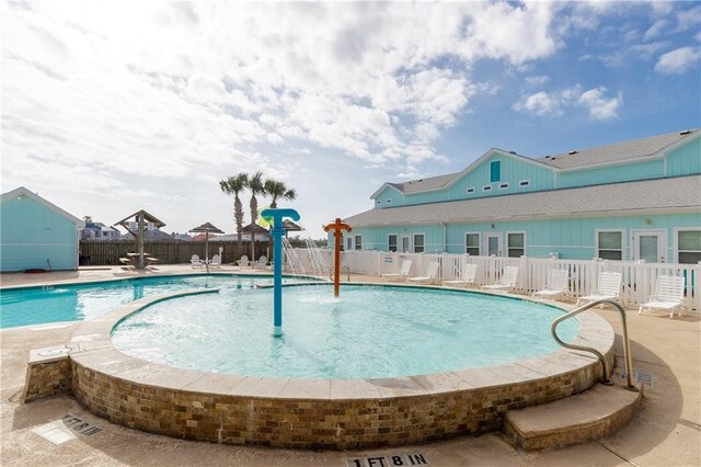 view of swimming pool featuring a patio