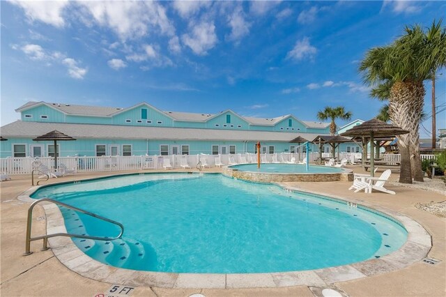 view of swimming pool featuring a gazebo and a patio area