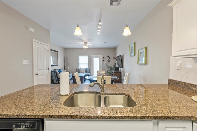 kitchen with white cabinetry, pendant lighting, sink, and ceiling fan