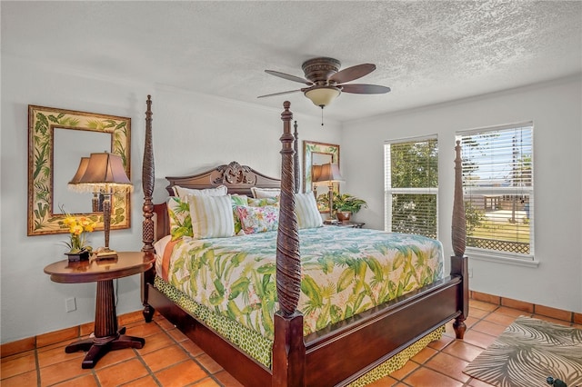 bedroom with light tile patterned floors, a textured ceiling, and ceiling fan