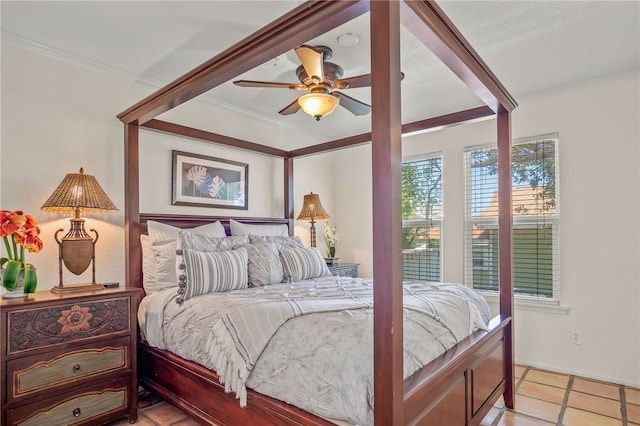 bedroom featuring crown molding, light tile patterned floors, and ceiling fan