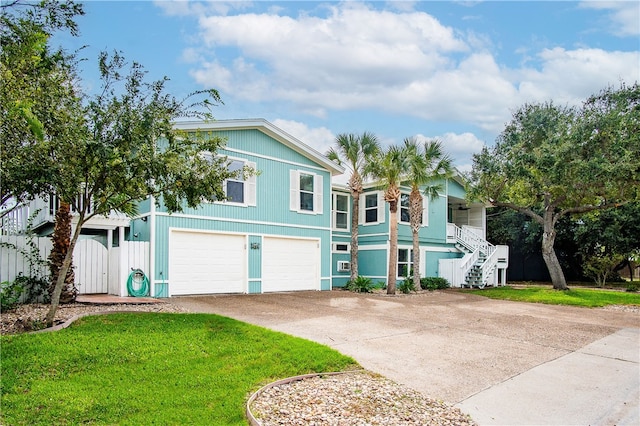 view of front of home featuring a garage and a front yard