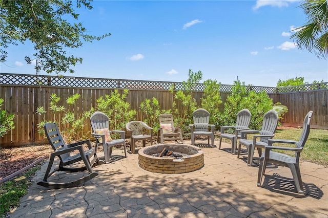 view of patio with a fire pit