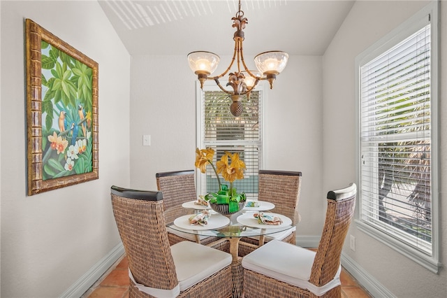 dining room featuring an inviting chandelier and a healthy amount of sunlight