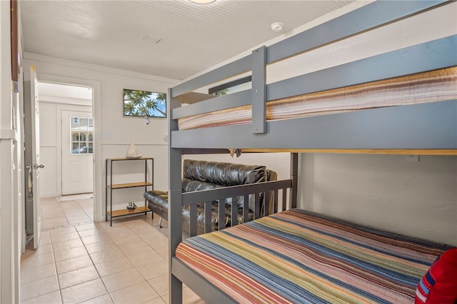 bedroom with light tile patterned floors