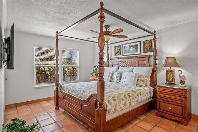 bedroom with ceiling fan and a textured ceiling