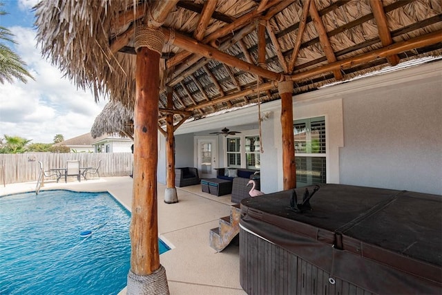view of pool featuring an outdoor living space, a fenced in pool, fence, ceiling fan, and a patio area