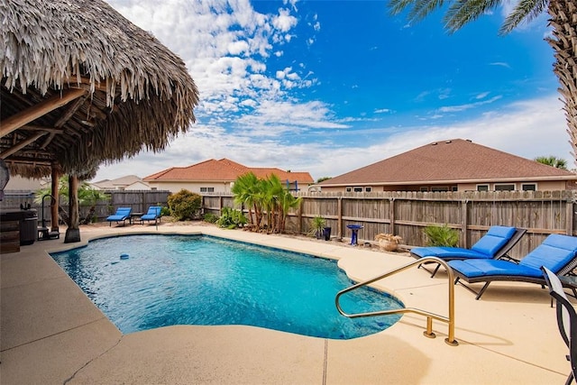 view of pool featuring a patio, a fenced backyard, and a fenced in pool