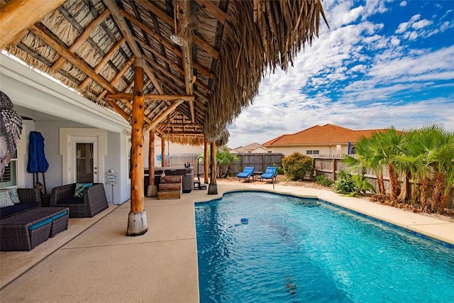 view of pool with a patio area, a fenced in pool, outdoor lounge area, and a fenced backyard