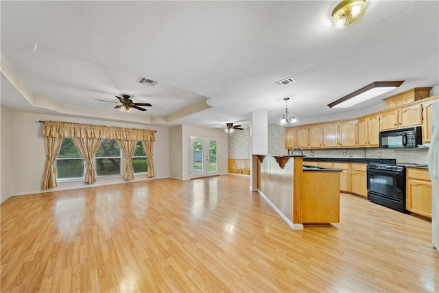 3606 Emory Dr, Corpus Christi, TX 78410 - kitchen with black appliances, a ceiling fan, dark countertops, open floor plan, and light wood-style floors