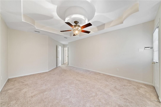 3606 Emory Dr, Corpus Christi, TX 78410 - empty room with a tray ceiling, light carpet, and ceiling fan