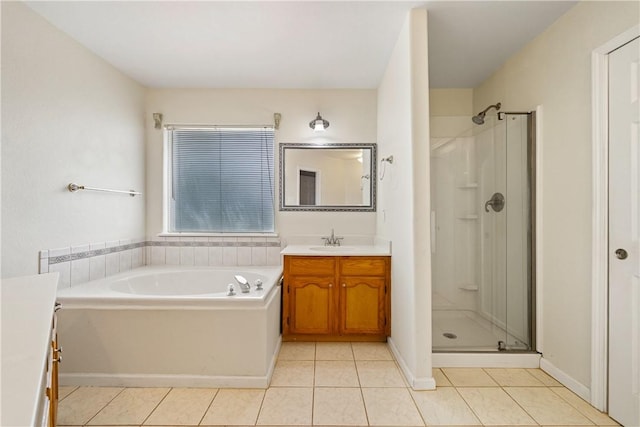 3606 Emory Dr, Corpus Christi, TX 78410 - full bathroom with vanity, a stall shower, tile patterned flooring, and a garden tub