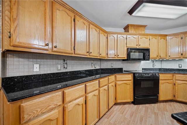 3606 Emory Dr, Corpus Christi, TX 78410 - kitchen featuring black appliances, light wood finished floors, tasteful backsplash, and dark stone countertops