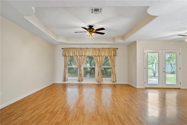 3606 Emory Dr, Corpus Christi, TX 78410 - empty room featuring ceiling fan, a raised ceiling, and healthy amount of natural light