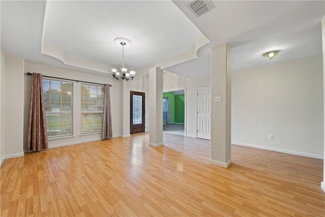 3606 Emory Dr, Corpus Christi, TX 78410 - spare room with a chandelier and light wood-style flooring