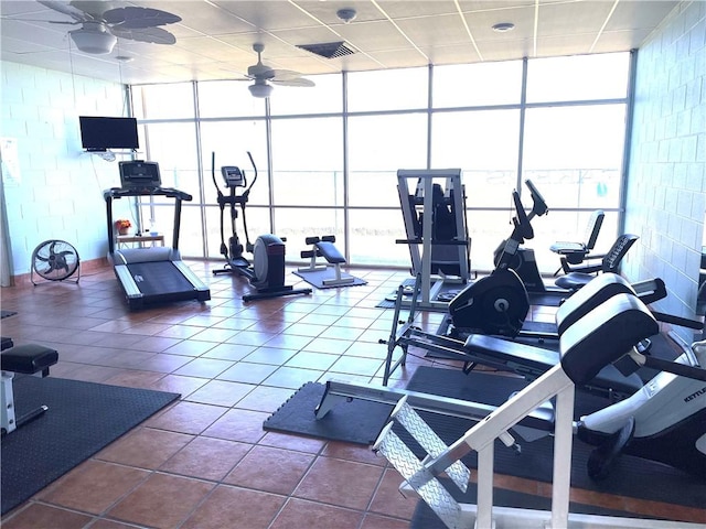 4242 Gulfbreeze Blvd Unit 606, Corpus Christi, TX 78402 - gym featuring a wall of windows, ceiling fan, plenty of natural light, and tile patterned floors
