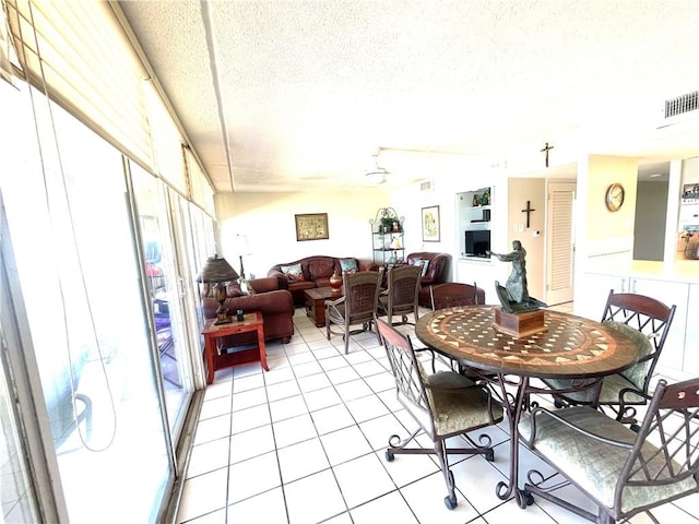 4242 Gulfbreeze Blvd Unit 606, Corpus Christi, TX 78402 - dining room with light tile patterned floors and a textured ceiling