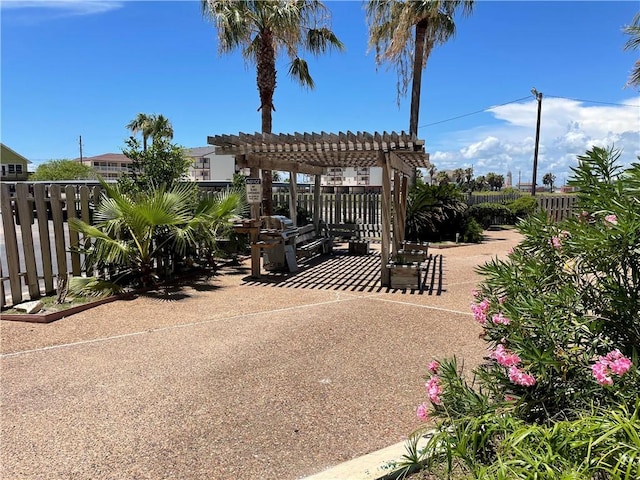 4242 Gulfbreeze Blvd Unit 606, Corpus Christi, TX 78402 - view of patio featuring a pergola and area for grilling