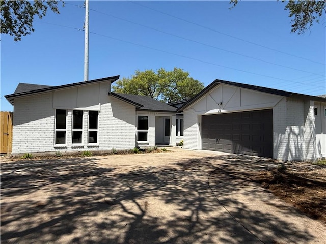 2413 Still Brook Dr, Corpus Christi, TX 78414 - view of front of house with brick siding, an attached garage, and concrete driveway
