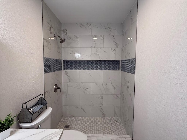 2413 Still Brook Dr, Corpus Christi, TX 78414 - full bathroom with toilet, tiled shower, and a textured wall