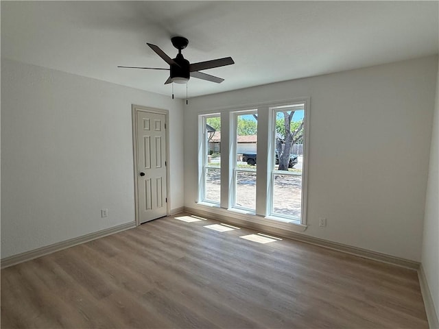 2413 Still Brook Dr, Corpus Christi, TX 78414 - unfurnished room featuring baseboards, a ceiling fan, and wood finished floors