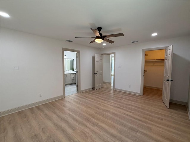2413 Still Brook Dr, Corpus Christi, TX 78414 - unfurnished bedroom with light wood finished floors, baseboards, a spacious closet, and recessed lighting